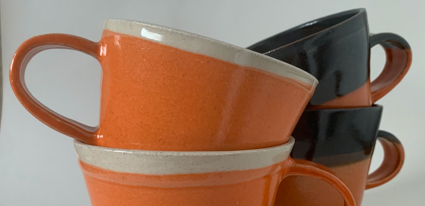 Orange mugs by Louise Kelly Pottery